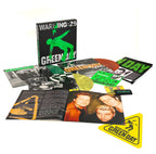Warning (25th anniversary Deluxe edition) - LP BOX Exclusiva (5LP Color Verde, Amarillo y Naranja + Libreto + Parche + Póster + Botones + Pegatina "Warning")